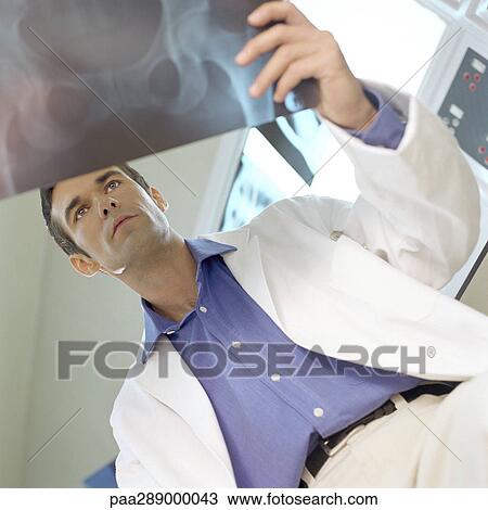 Male doctor in x-ray lab View Large Photo Image Stock Image - Male doctor in x-ray lab. Fotosearch