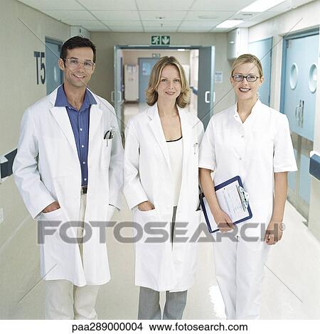 Picture - Medical staff standing in hospital corridor. Fotosearch
