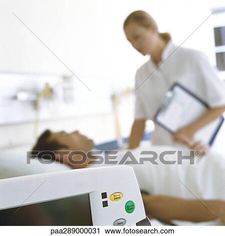 Nurse checking on patient View Large Photo Image Stock Image - Nurse checking on patient. Fotosearch