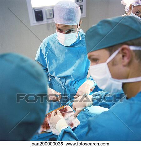 Doctors performing operation View Large Photo Image Stock Photography - Doctors performing operation. Fotosearch