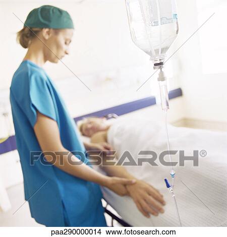 Stock Photo - Intern taking patient's pulse. Fotosearch - Search Stock Images, Mural Photographs, Pictures, and Clipart Photos