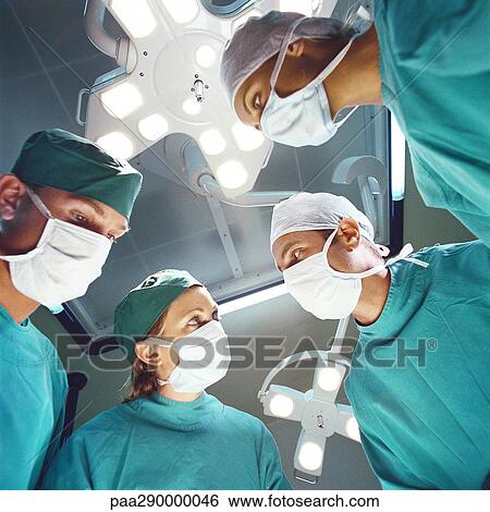 Surgical team, low angle view View Large Photo Image Stock Photograph - Surgical team, low angle view. Fotosearch