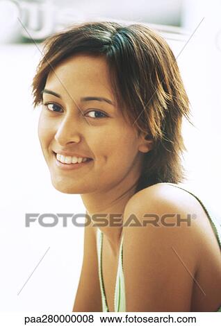 Teenage girl smiling, looking at camera, portrait View Large Photo Image Stock Photo - Teenage girl smiling, looking at camera, portrait. Fotosearch