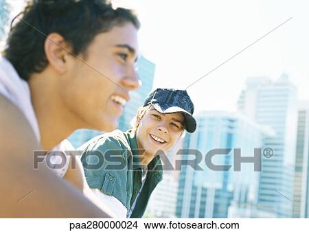 Two teenage boys in city setting View Large Photo Image Picture - Two teenage boys in city setting. Fotosearch