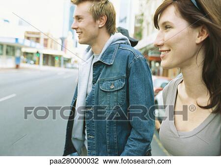 Young couple in street View Large Photo Image Stock Image - Young couple in street. Fotosearch