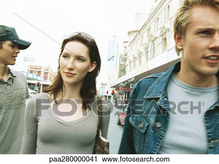 Stock Image - Young people in city setting. Fotosearch
