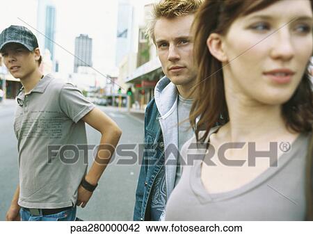 Young people standing in street View Large Photo Image Stock Image - Young people standing in street. Fotosearch