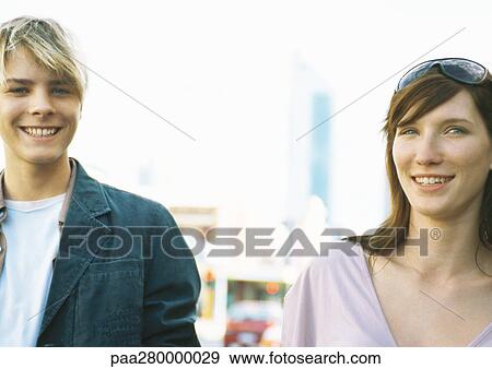 Young woman and teenage boy, smiling at camera View Large Photo Image Stock Photo - Young woman and teenage boy, smiling at camera. Fotosearch