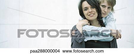 Young couple embracing View Large Photo Image Picture - Young couple embracing. Fotosearch