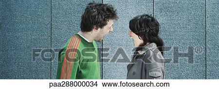 Picture - Young couple screaming at each other. Fotosearch