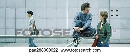 Young people in urban setting View Large Photo Image Stock Image - Young people in urban setting. Fotosearch