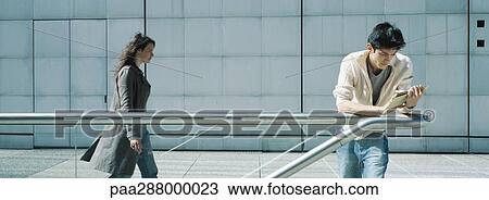 Young people in urban setting View Large Photo Image Stock Image - Young people in urban setting. Fotosearch