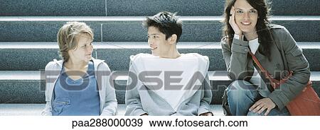 Young people sitting on steps View Large Photo Image Stock Photo - Young people sitting on steps. Fotosearch