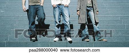 Young people standing on steps, waist down View Large Photo Image Stock Image - Young people standing on steps, waist down. Fotosearch