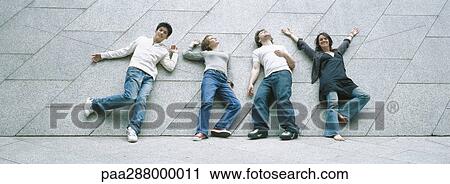 Young people striking poses View Large Photo Image Stock Image - Young people striking poses. Fotosearch