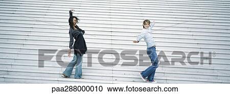 Young women dancing on steps View Large Photo Image Stock Image - Young women dancing on steps. Fotosearch