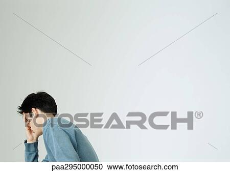 Young man covering face with hand View Large Photo Image Stock Image - Young man covering face with hand. Fotosearch
