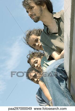 Group of young people, low angle view View Large Photo Image Stock Photo - Group of young people, low angle view. Fotosearch