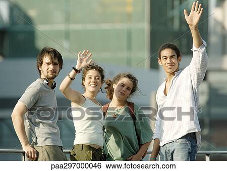 Group of young people waving View Large Photo Image Stock Photograph - Group of young people waving. Fotosearch