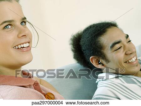 Picture - Young people smiling, close-up. Fotosearch