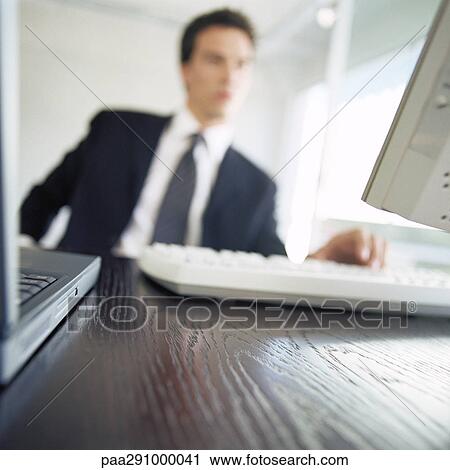 Businessman in office View Large Photo Image Stock Image - Businessman in office. Fotosearch