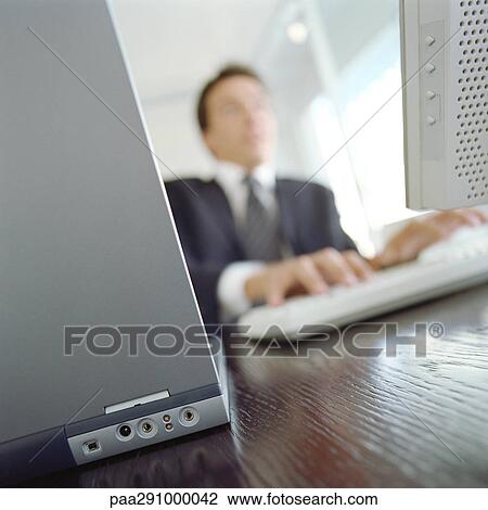 Businessman in office View Large Photo Image Stock Image - Businessman in office. Fotosearch