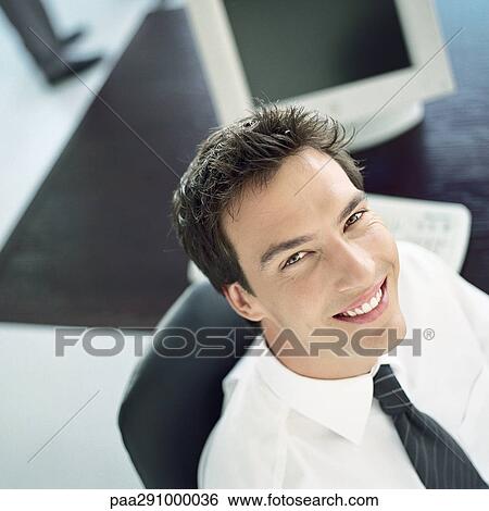 Stock Photograph - Businessman in office. Fotosearch