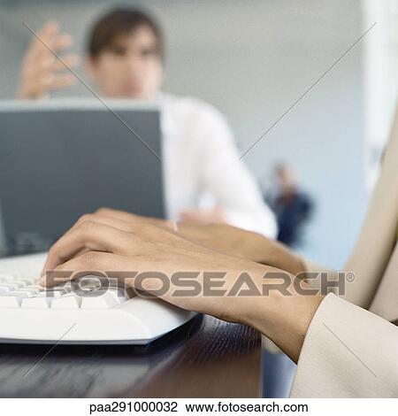 Businesspeople in office, close-up of hands on keyboard View Large Photo Image Stock Image - Businesspeople in office, close-up of hands on keyboard. Fotosearch