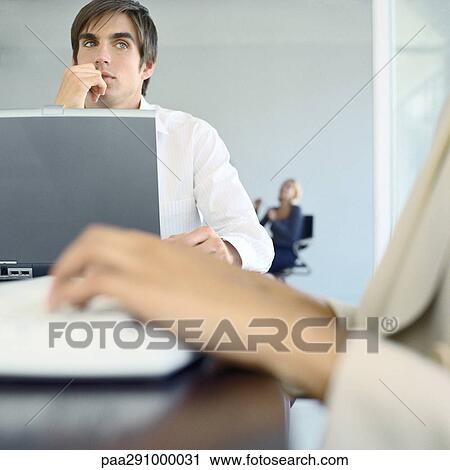 Businesspeople in office View Large Photo Image Stock Image - Businesspeople in office. Fotosearch