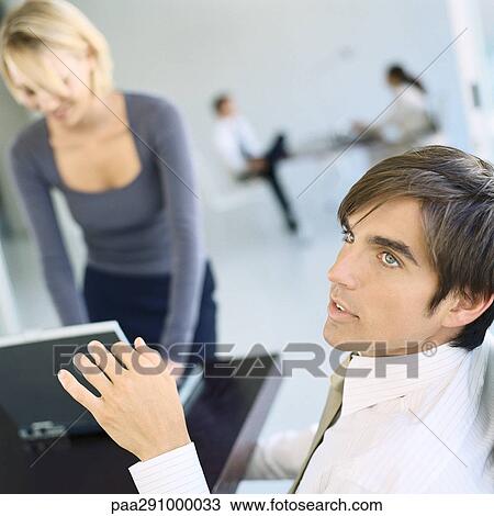 Businesspeople in office View Large Photo Image Stock Image - Businesspeople in office. Fotosearch