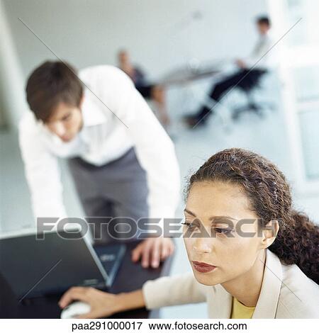 Businesspeople in office View Large Photo Image Stock Photo - Businesspeople in office. Fotosearch