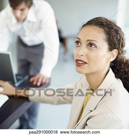 Stock Photo - Businesspeople in office. Fotosearch
