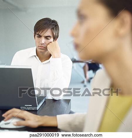 Businesspeople in office View Large Photo Image Stock Photo - Businesspeople in office. Fotosearch