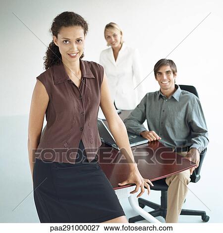 Businesspeople in office View Large Photo Image Stock Photo - Businesspeople in office. Fotosearch