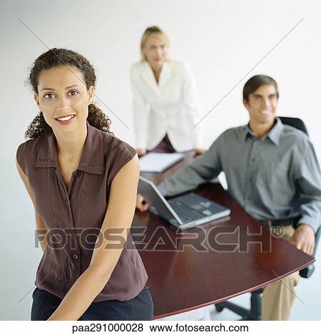 Businesspeople in office View Large Photo Image Stock Photo - Businesspeople in office. Fotosearch