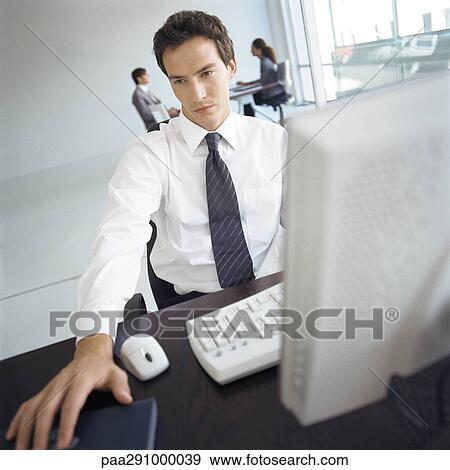 Businesspeople in office View Large Photo Image Stock Photo - Businesspeople in office. Fotosearch