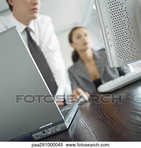 Businesspeople in office View Large Photo Image Stock Photography - Businesspeople in office. Fotosearch
