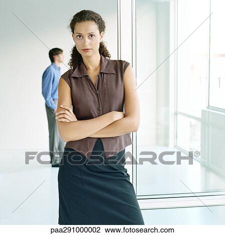 Stock Image - Businesspeople in workspace. Fotosearch