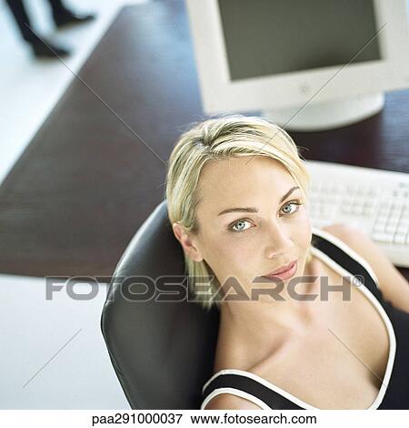 Stock Photo - Businesswoman in office. Fotosearch