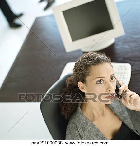 Businesswoman on phone in office View Large Photo Image Stock Photo - Businesswoman on phone in office. Fotosearch