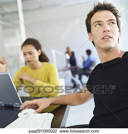 Casually dressed people working in office View Large Photo Image Stock Image - Casually dressed people working in office. Fotosearch