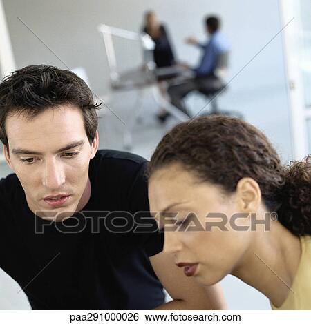 Casually dressed people working in office View Large Photo Image Stock Photograph - Casually dressed people working in office. Fotosearch