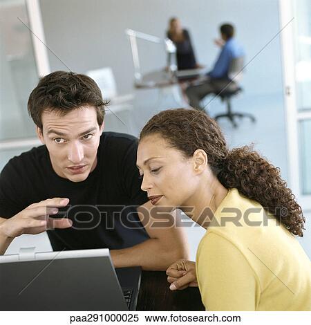 Stock Photography - Casually dressed people working in office. Fotosearch