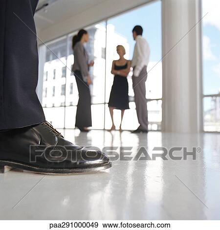 Well-dressed man's leg, well-dressed group standing near window View Large Photo Image Stock Photo - Well-dressed man's leg, well-dressed group standing near window. Fotosearch