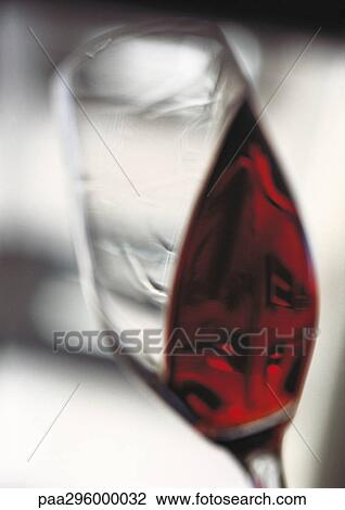 Glass of red wine being swirled View Large Photo Image Stock Image - Glass of red wine being swirled. Fotosearch