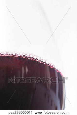 Stock Image - Glass of red wine. Fotosearch