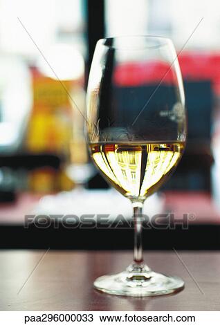 Glass of white wine View Large Photo Image Stock Image - Glass of white wine. Fotosearch