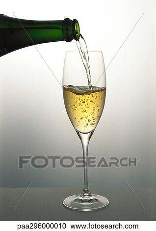 Pouring a glass of Champagne View Large Photo Image Stock Image - Pouring a glass of Champagne. Fotosearch