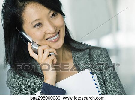 Businesswoman using cell phone View Large Photo Image Stock Image - Businesswoman using cell phone. Fotosearch