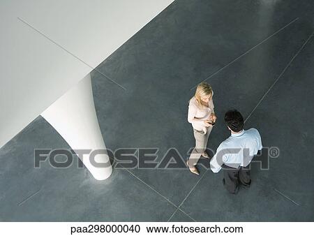 Man and woman talking, high angle view View Large Photo Image Stock Image - Man and woman talking, high angle view. Fotosearch